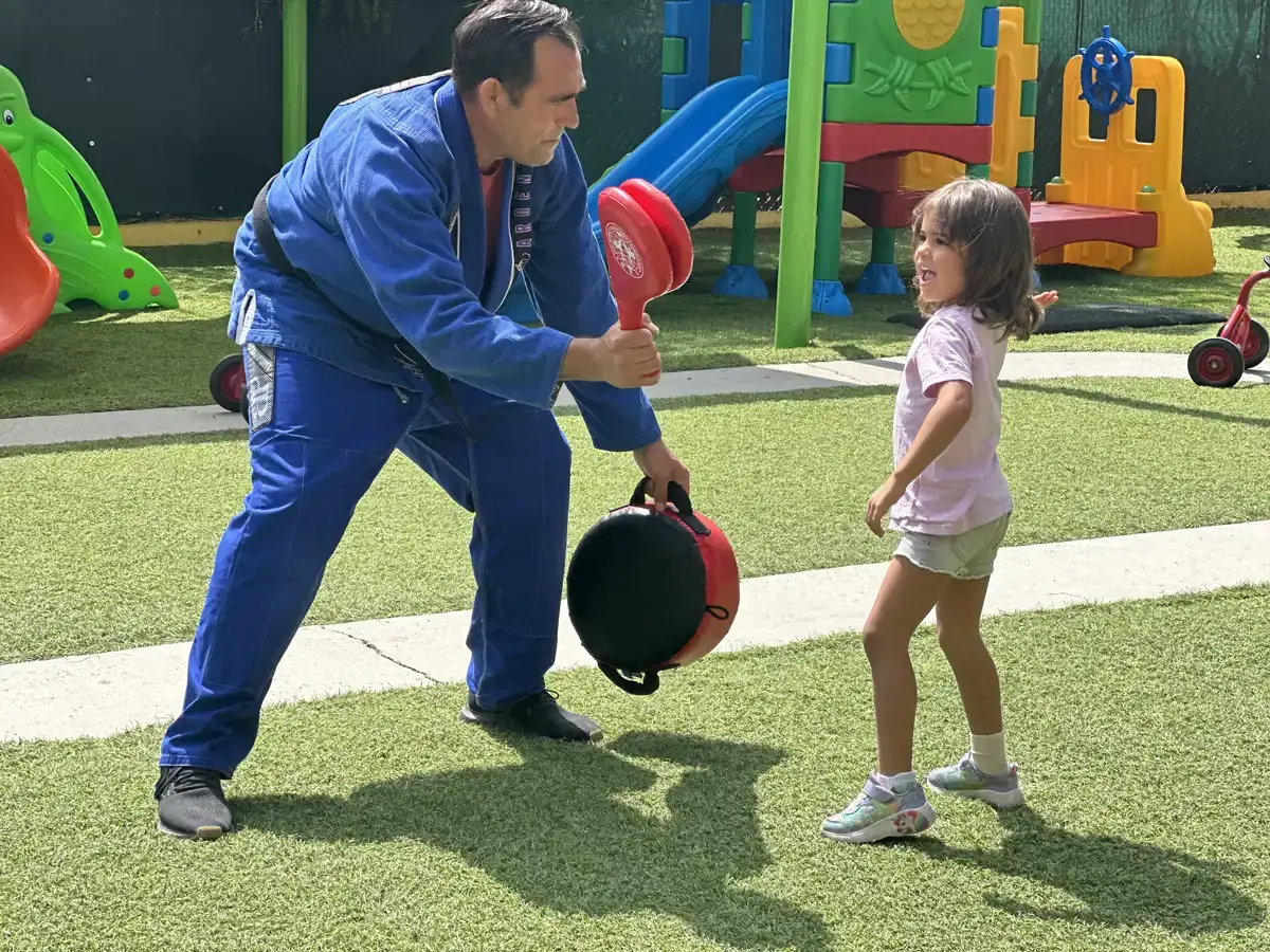 Children practicing non-contact martial arts in Sierra Preschool's Tae Kwon Do enrichment program