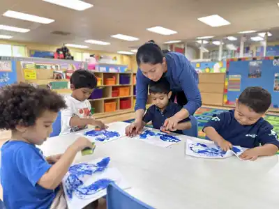 Preschool children engaged in calm, focused classroom learning activities in a Montessori-inspired environment at Sierra Preschool